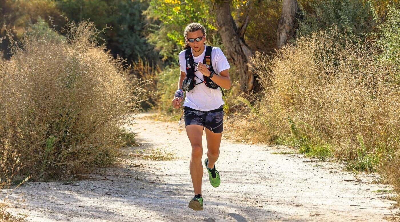 Woman running on trail in mountains