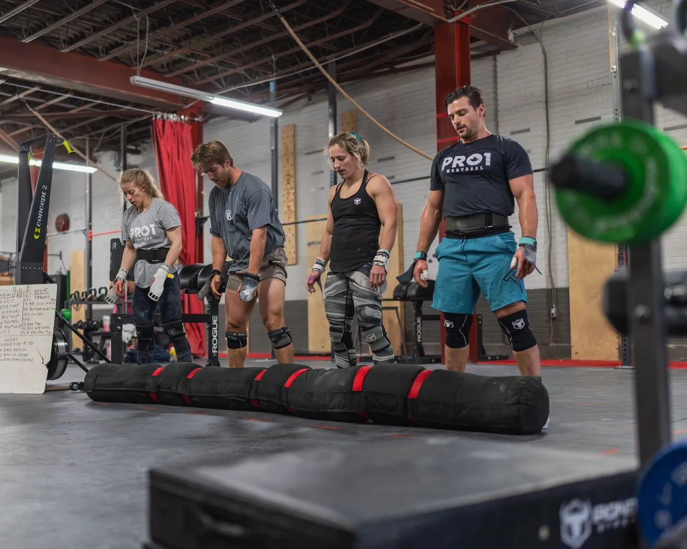 Crossfitters wearing knee sleeves together