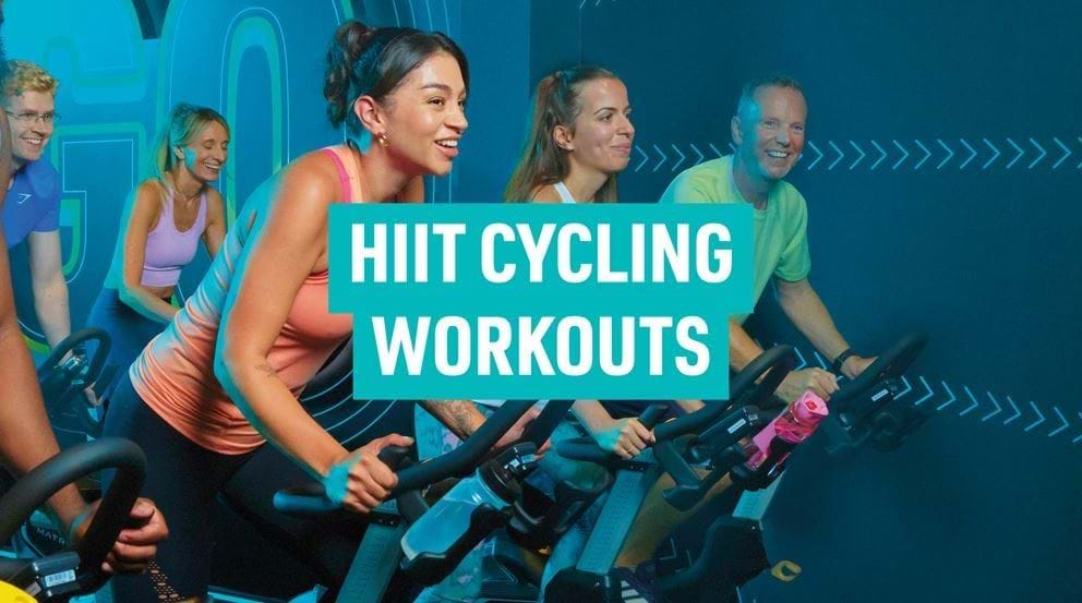 People cycling in HIIT gym class