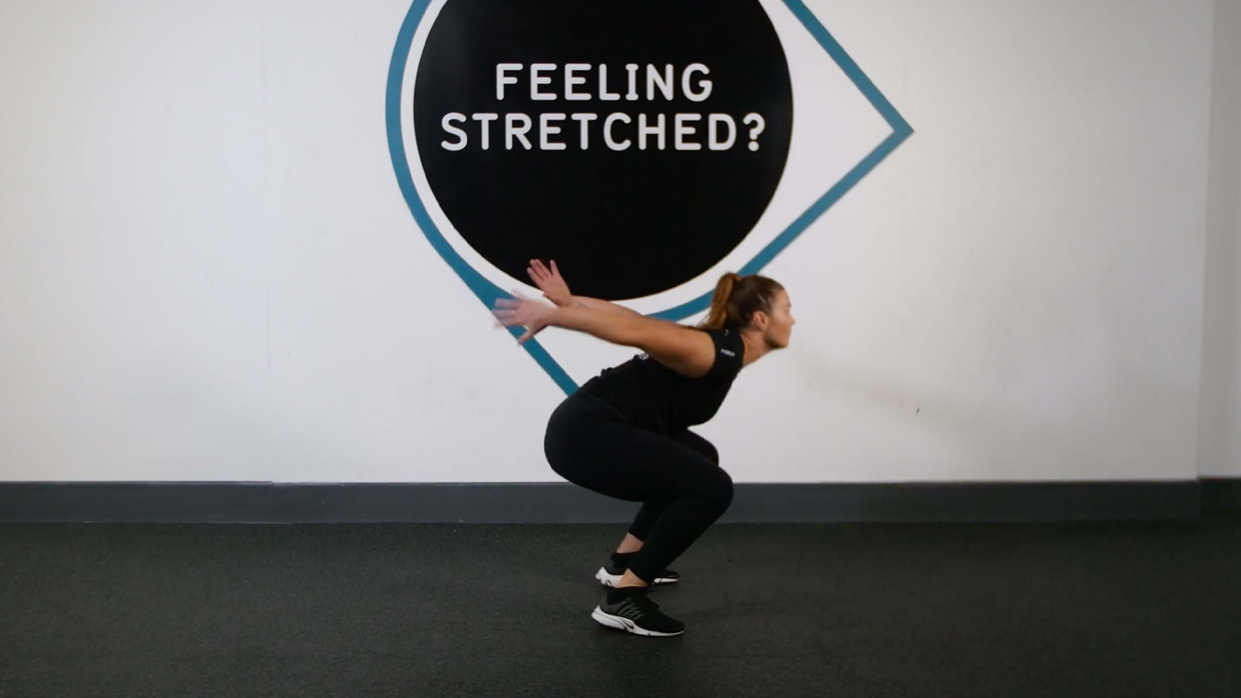 Woman performing squat jump exercise