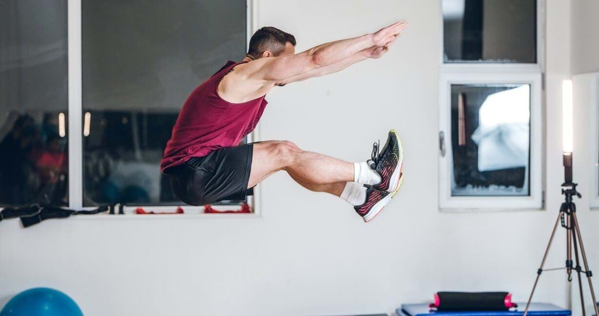 Person performing pike jump exercise