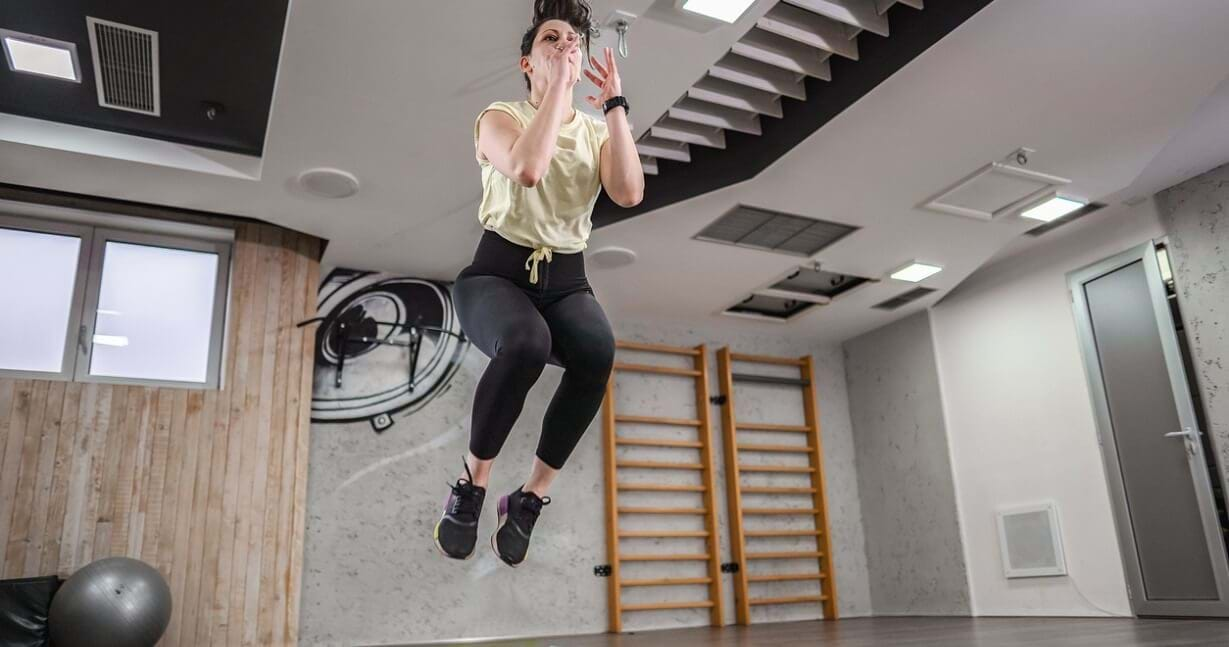 Woman performing lateral jump exercise