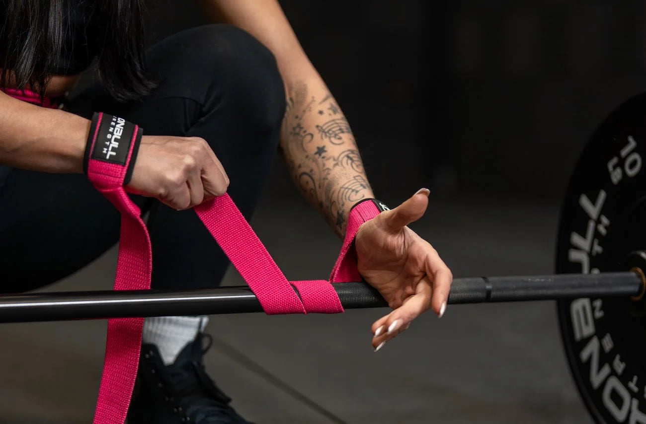 Person using pink lifting straps