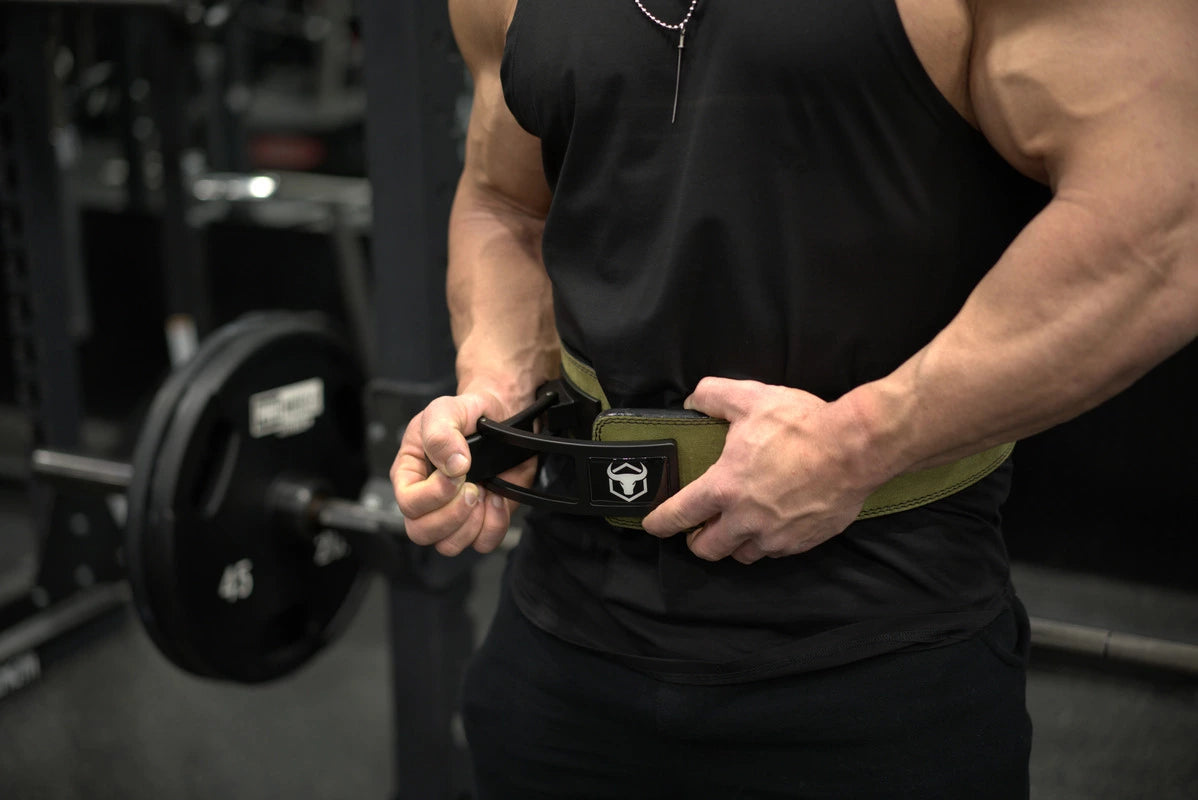 Man tightening weightlifting belt