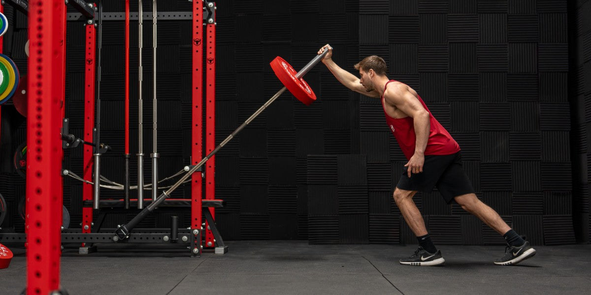 Man performing landmine press exercise