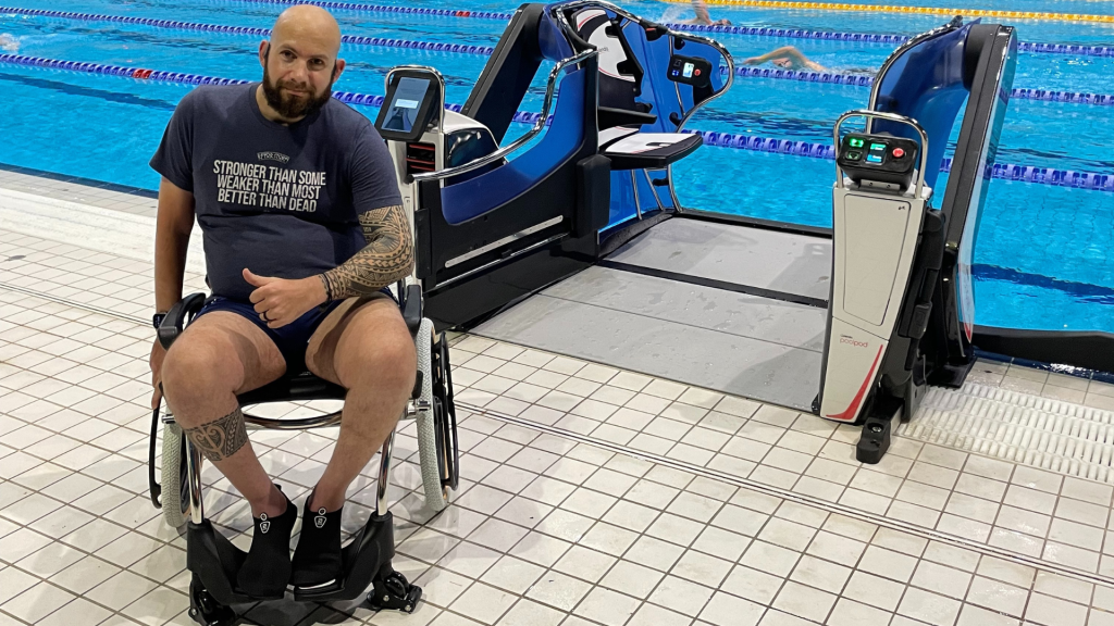 Man in wheelchair at poolside