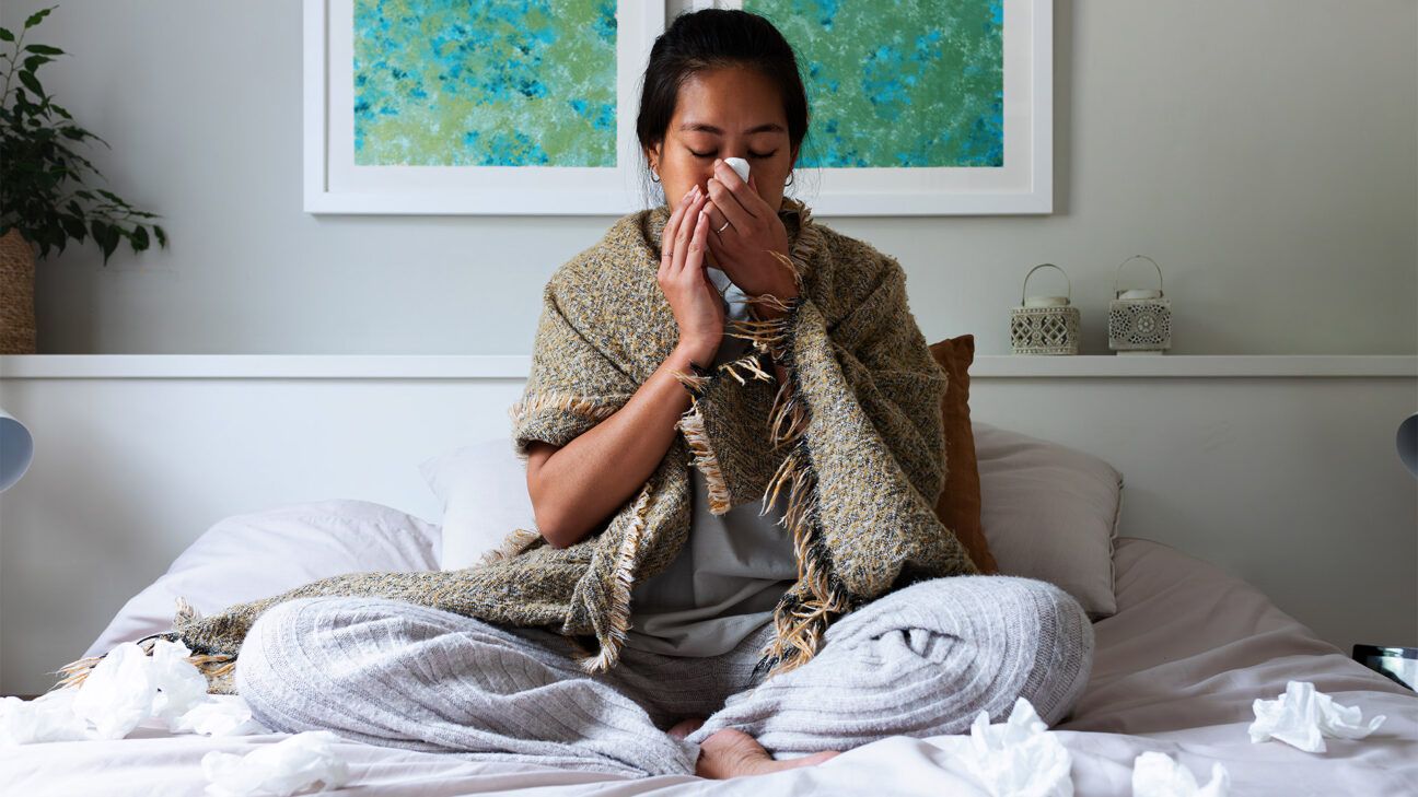 Woman with illness resting in bed