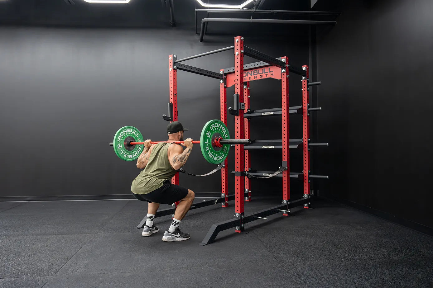 Man using power rack for weightlifting