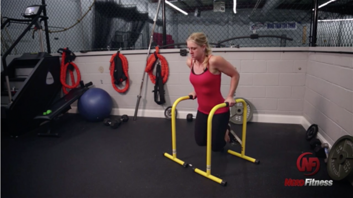 Staci doing parallel bar dips