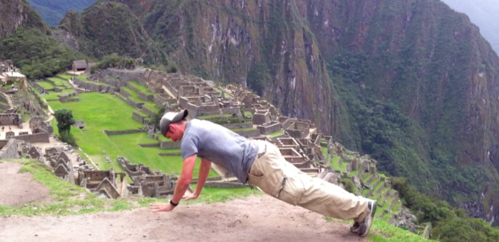 Man doing mountain pushup at sunset