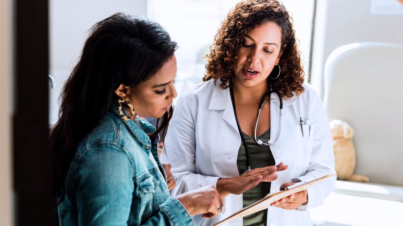 Woman speaking with doctor at appointment