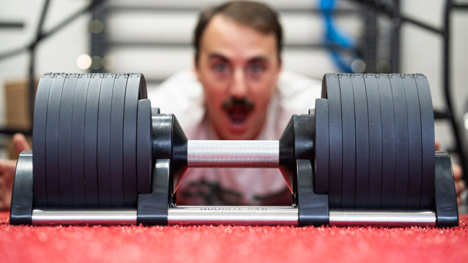 NUOBELL adjustable dumbbells on mat