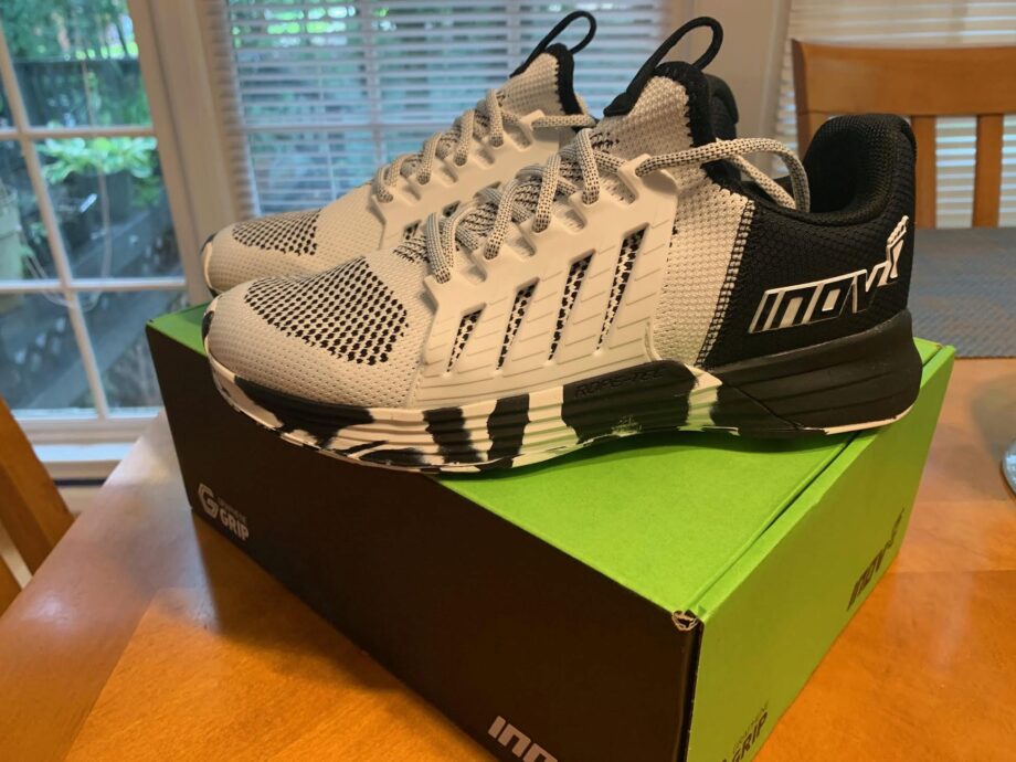 White and black Inov-8 shoes