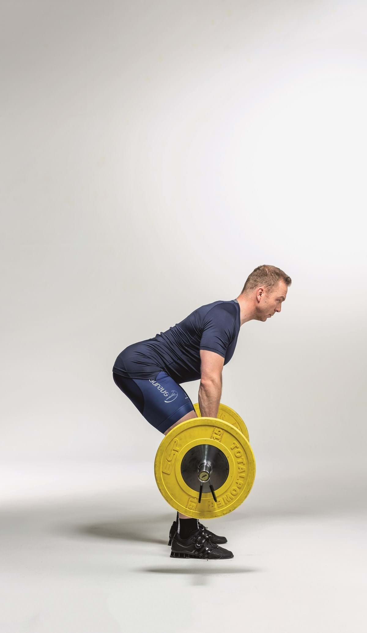 Man doing Romanian deadlift exercise