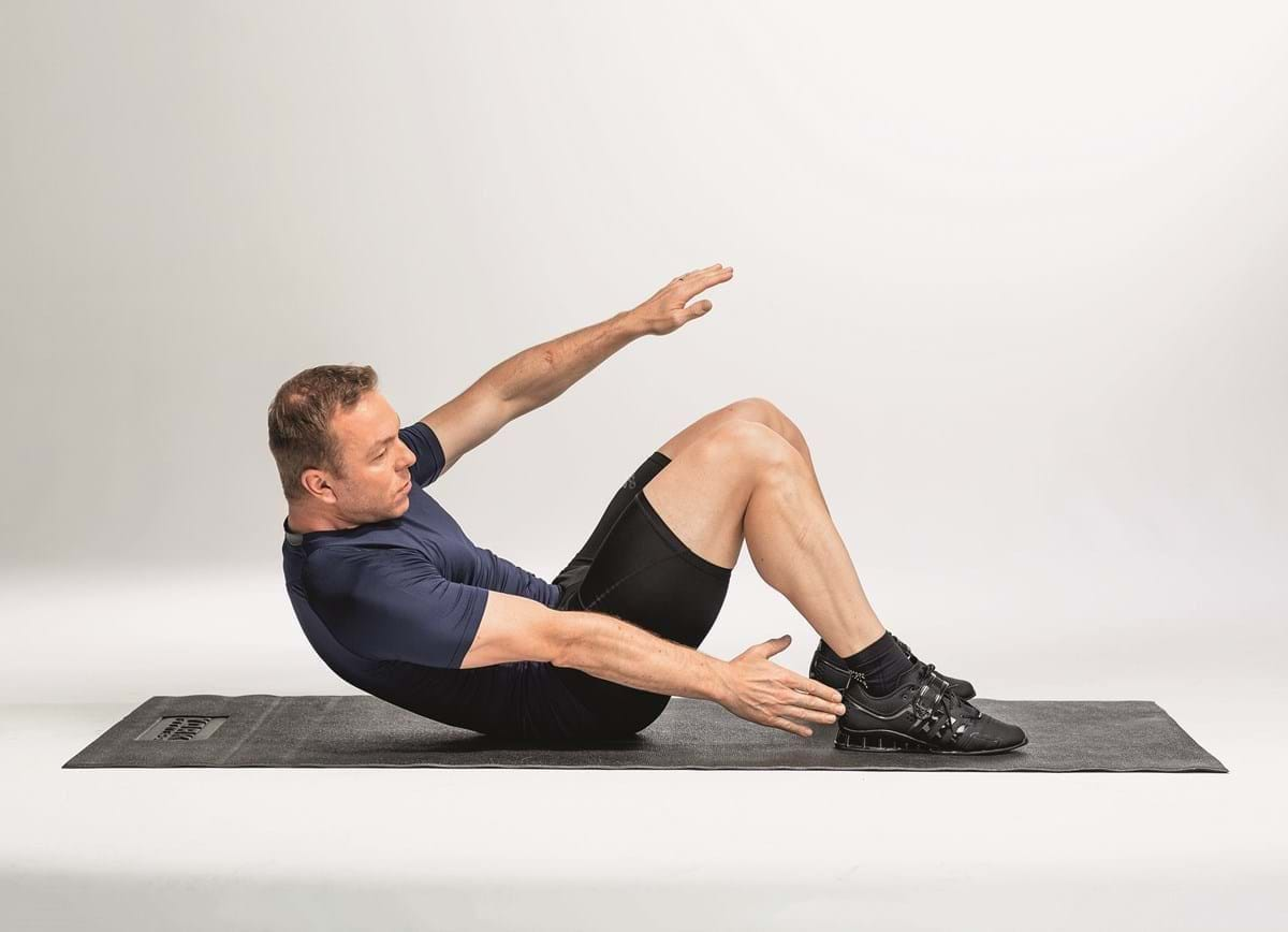 Man in yoga boat pose