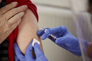 Healthcare worker administers vaccine shot