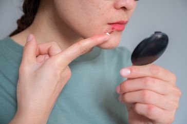 Woman testing blood sugar level