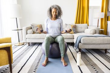 Woman doing lunges at home