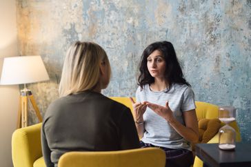 Woman talking to therapist in office