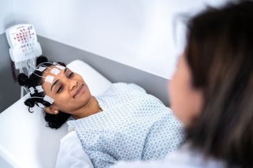 Woman undergoing EEG examination