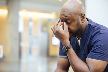 Man holding head in pain