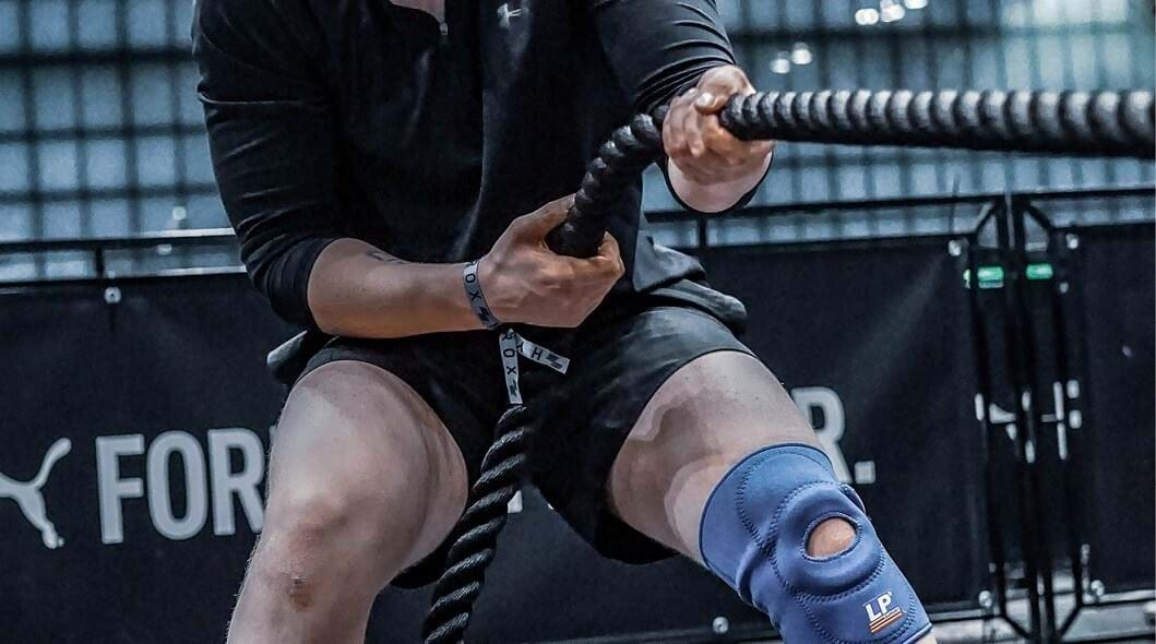 Athlete pulling sled during workout competition